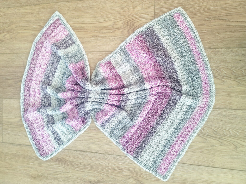 Edgewater Textured Crochet Blanket Pattern - blanket scrunched in the center