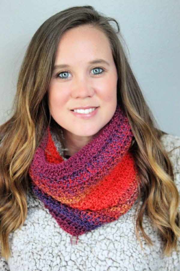 Woman wearing the Edgewater Cowl made in Knit Picks Chroma Twist Worsted yarn. 