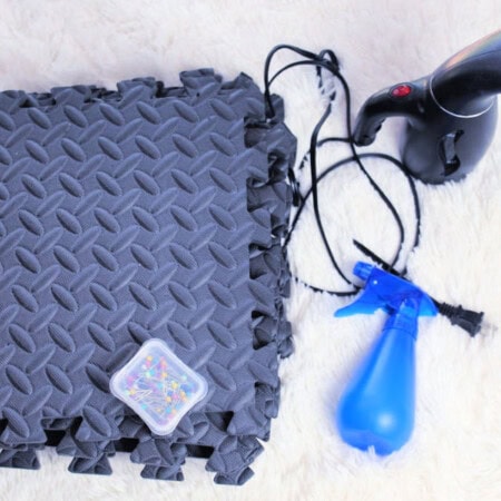 Crochet Blocking Tools including foam mats, pins, steamer, and spray bottle.