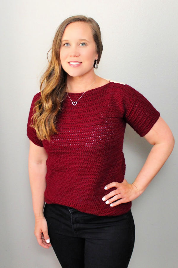 Woman wearing a maroon colored crochet top called the Tea Time Tee. 