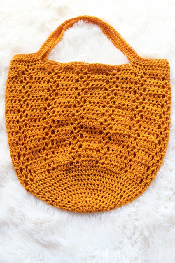 Yellow crochet bag called the Sabre Bag.