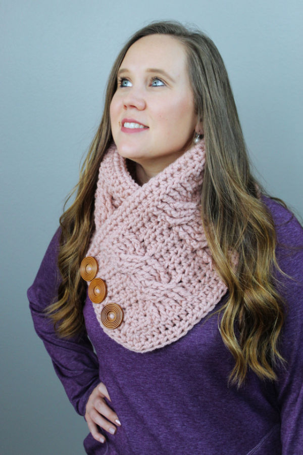 Woman wearing a pink crochet cowl, called the Alexis Cowl. 