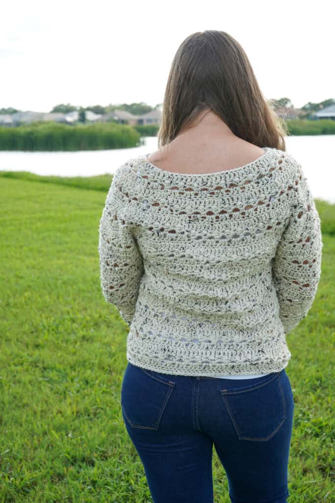 Back view of the women's crochet sweater called the Brimstone Sweater.