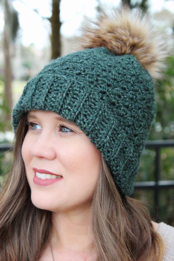 Close up of green crochet hat, called the Ferguson Hat. 