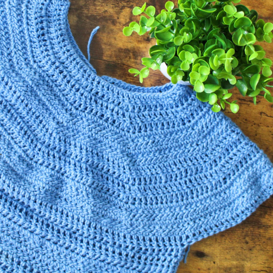 Close up of blue crochet top, called the Larkin Tee. 