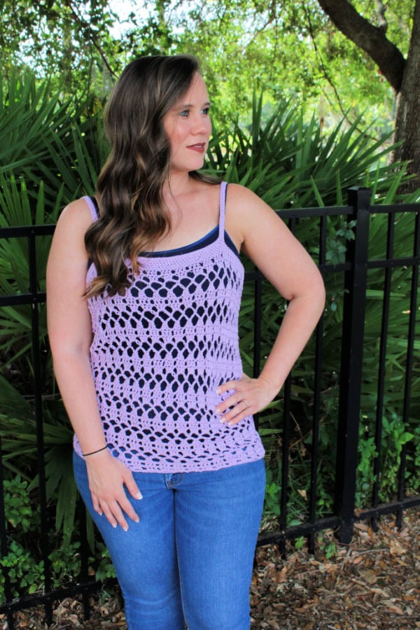 Woman wearing a light purple crochet tank top, called the Sarasota Tank. 