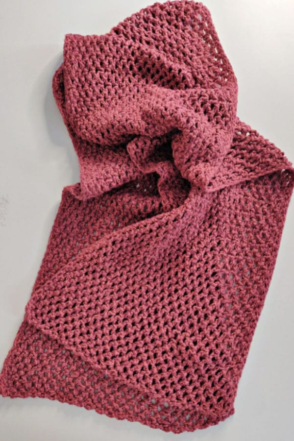 Close up of a pink crochet scarf, called the Vintage Rose Scarf. 