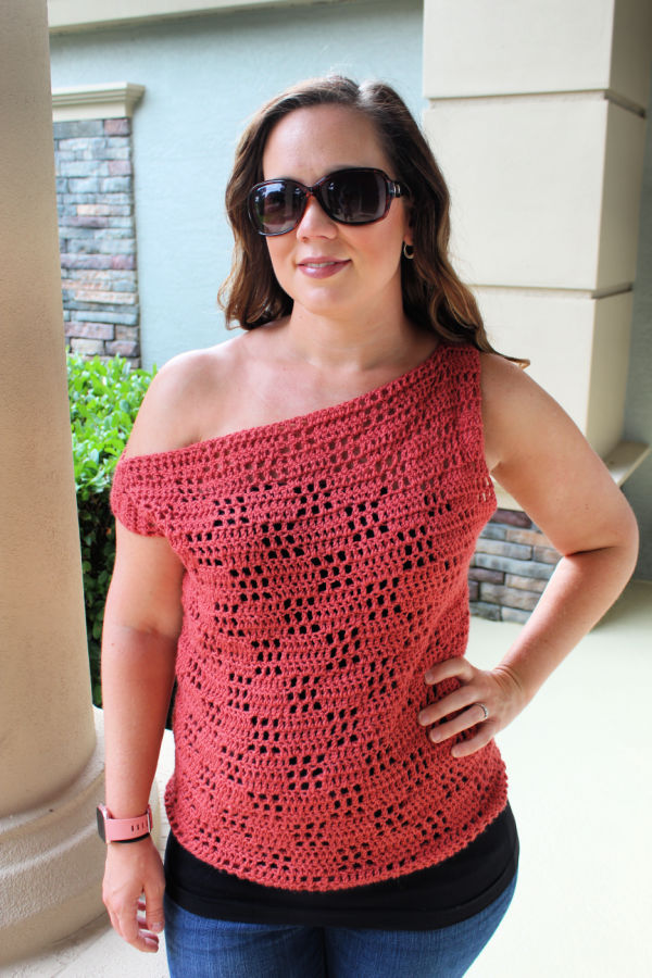 Woman wearing a filet crochet top called the Valerie Tee. 
