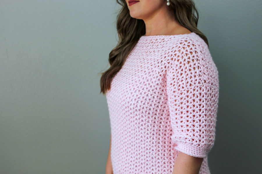 Close up of woman wearing an easy crochet sweater, called the Spring Breeze Sweater. 