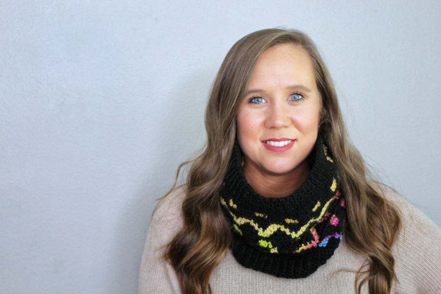 Woman wearing a crochet cowl, called the Camden Cowl. 