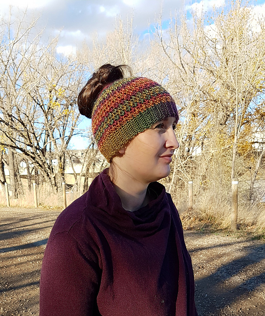 Photo of woman wearing the messy bun version of the Savannah Slouch hat. 