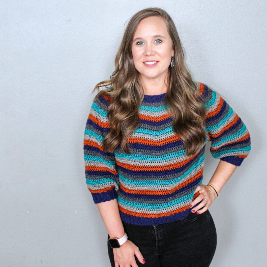 Woman wearing a vintage striped crochet sweater, called the Vinnie Sweater.
