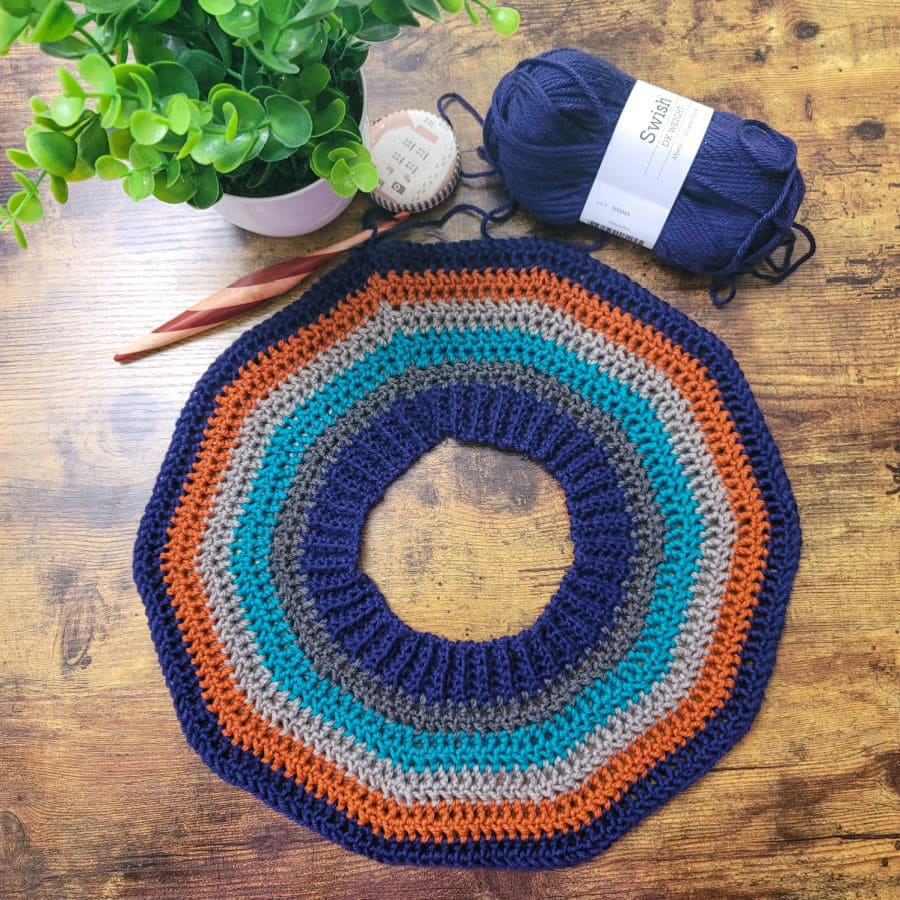 Flat lay photo of the yoke of the Vinnie Sweater crochet pattern. 