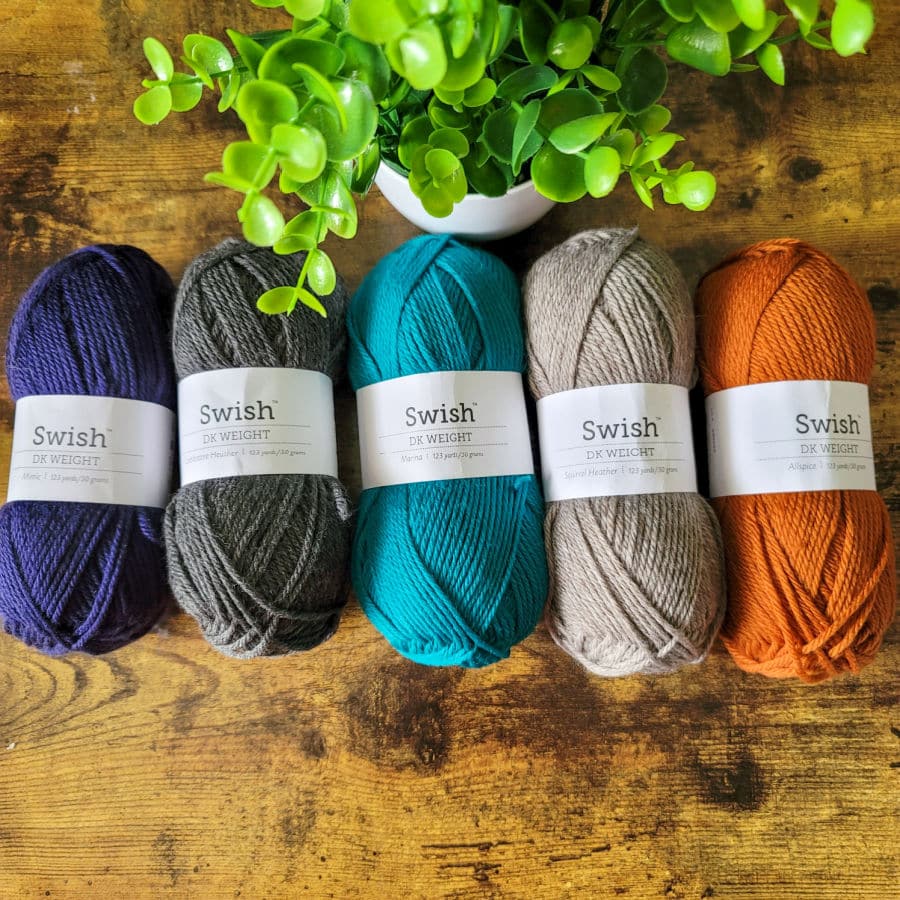 Photo of the 5 colors of yarn used to make the Vinnie Sweater. 