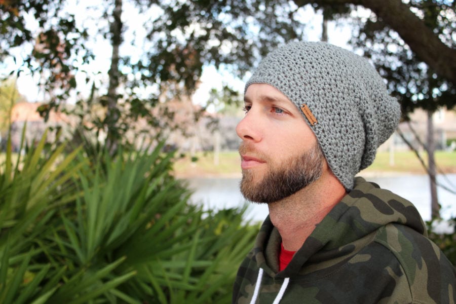 Man wearing a gray crochet slouch hat called the Boston Slouch. 