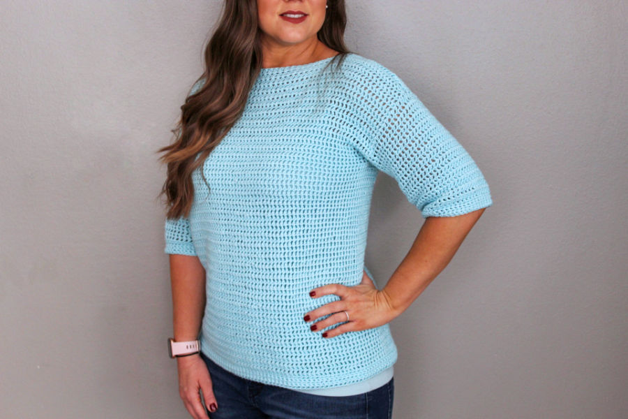 Close up of the neckline and 3/4 sleeve of the crochet sweater, the Springtime Sweater. 