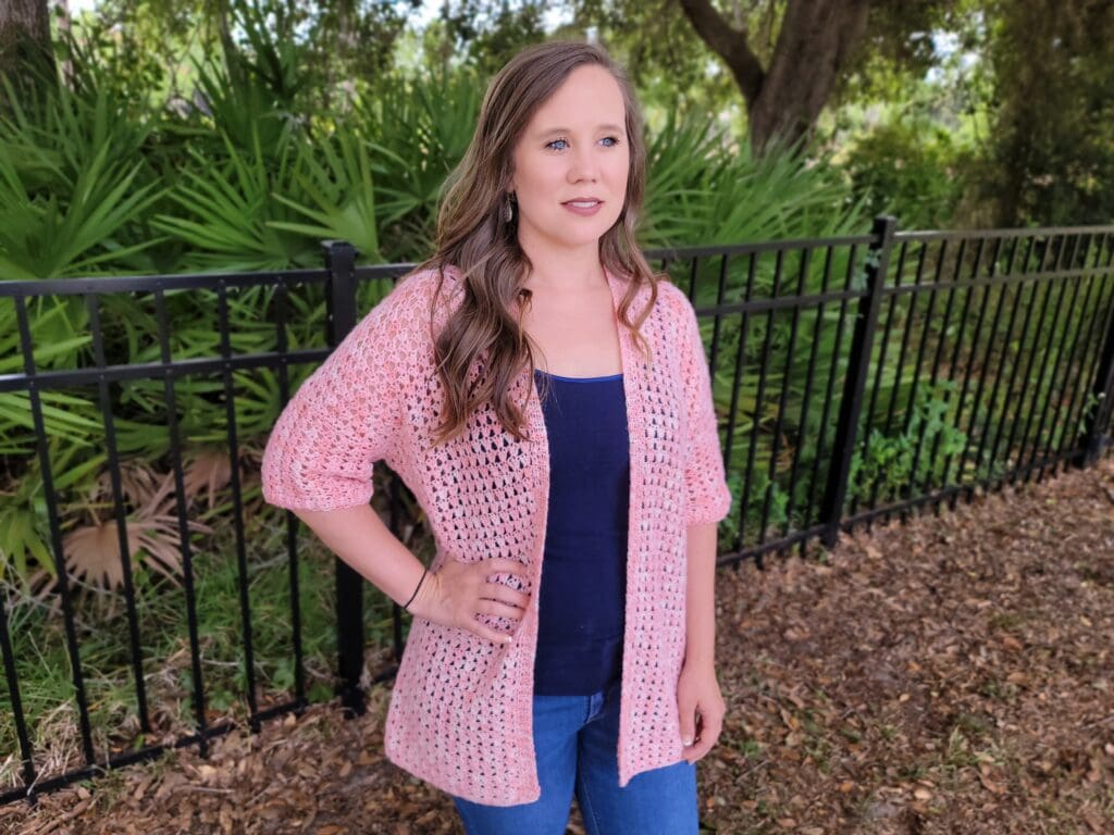 Woman wearing the Jayda Cardigan crochet pattern.