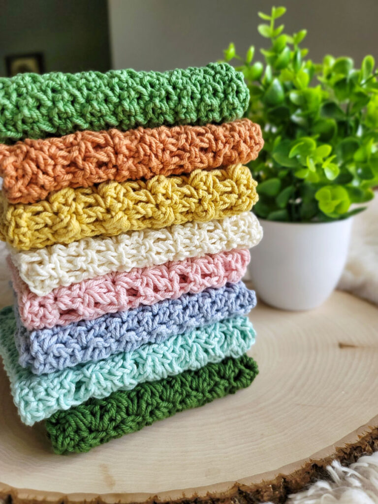 8 crochet washcloths piled on top of each other. 