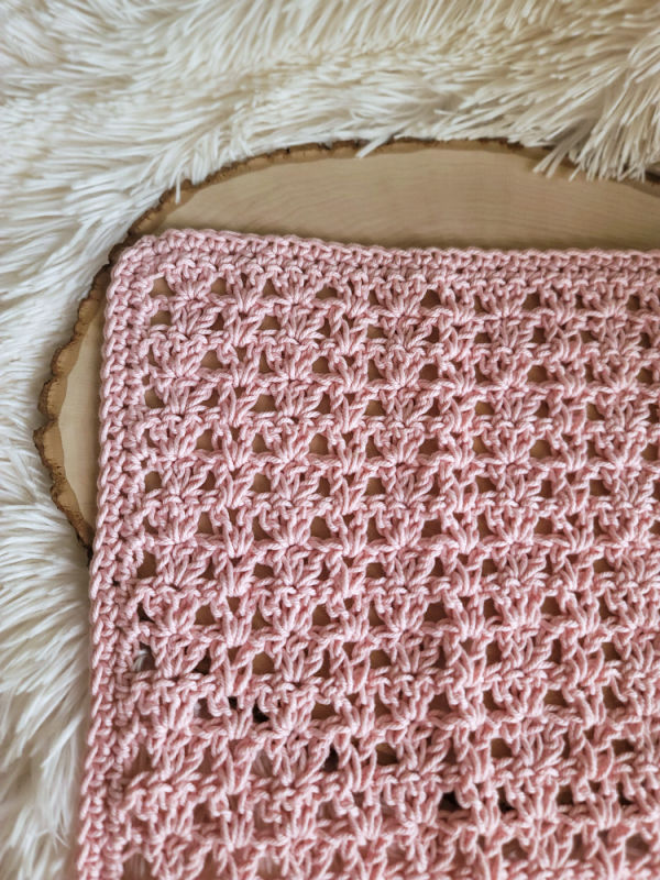 Pink crochet washcloth, called the Katie Washcloth.