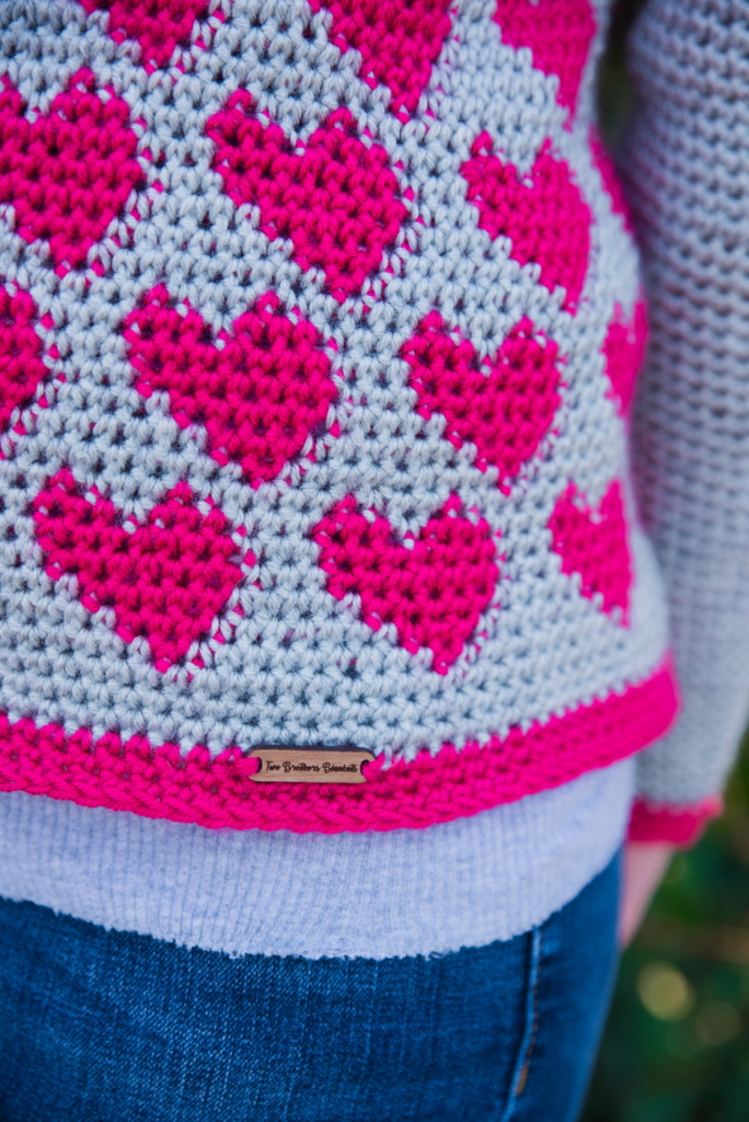 Close up view of the hearts on the Crochet Heart Sweater Pattern. 