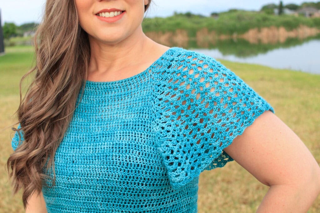 Close up of the lacy sleeve of the summer crochet top called the Rosie Tee.