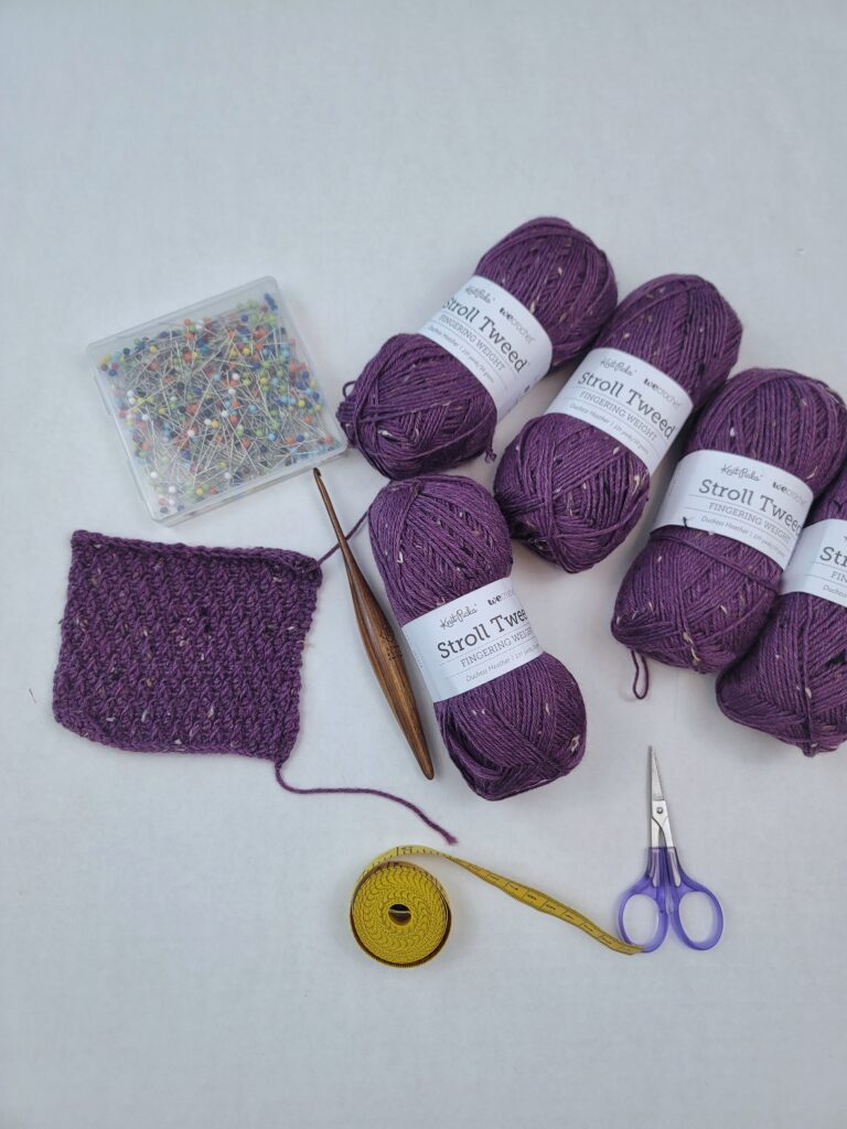WeCrochet Stroll Tweed Yarn, pins, and a crochet hook