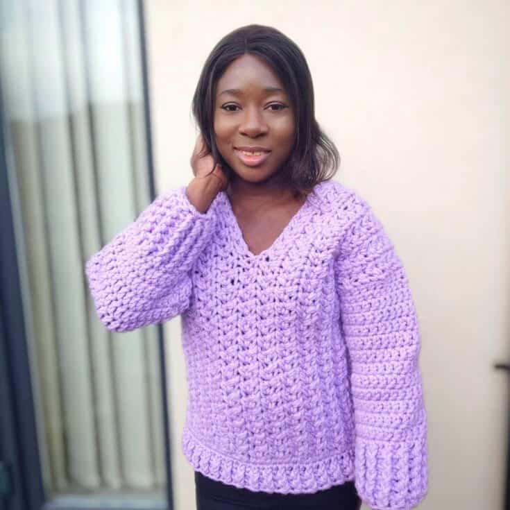 crochet sweater pattern with cabled detailing at front